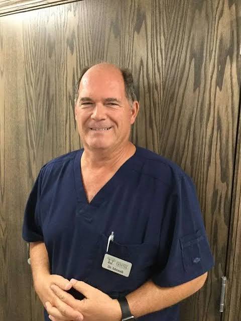 Professional dental coach reviewing AI-generated operational recommendations with a dental practice leadership team